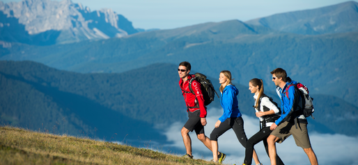 four hikers side by side on a hiking trail | © Helmuth Rier